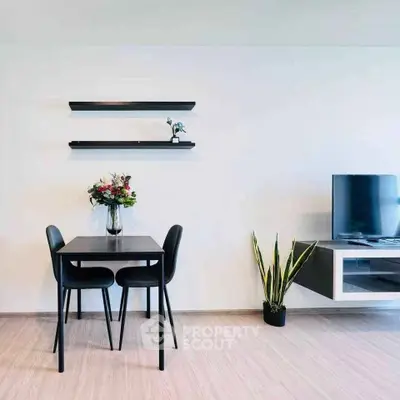 Modern minimalist living room with sleek furniture and wall-mounted TV