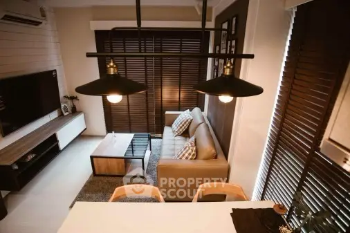 Stylish modern living room with cozy sofa and elegant lighting