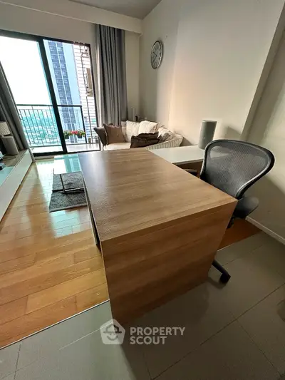 Modern study room with wooden desk and balcony view in stylish apartment
