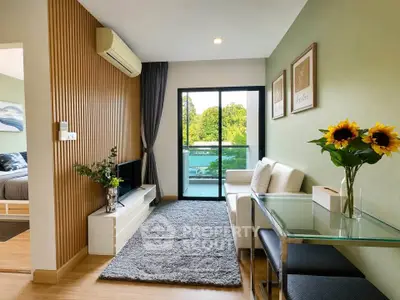 Modern living room with stylish decor and balcony view, featuring a cozy seating area and elegant wooden accents.