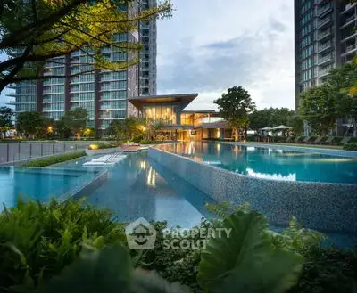 Luxurious condominium with stunning pool and modern architecture at dusk.