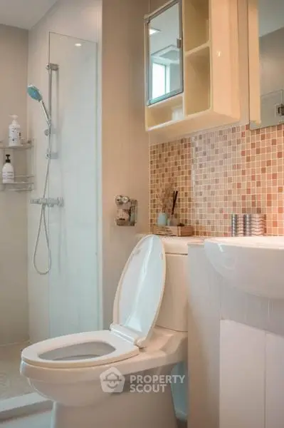 Modern bathroom with shower and stylish mosaic tiles