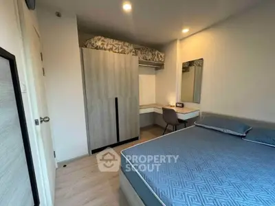 Modern bedroom with stylish decor and ample storage space