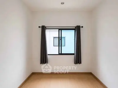 Minimalist empty room with window and curtains, perfect for customization.