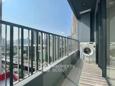 Spacious balcony with city view and washing machine, perfect for urban living.