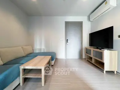 Modern living room with sleek furniture and air conditioning, perfect for relaxation and entertainment.