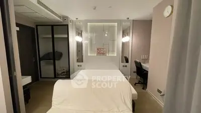 Modern bedroom with stylish decor and workspace in elegant apartment