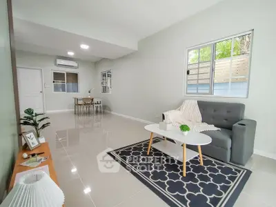 Spacious modern living room with sleek tile flooring and stylish decor