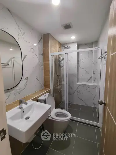 Modern bathroom with sleek fixtures and marble accents