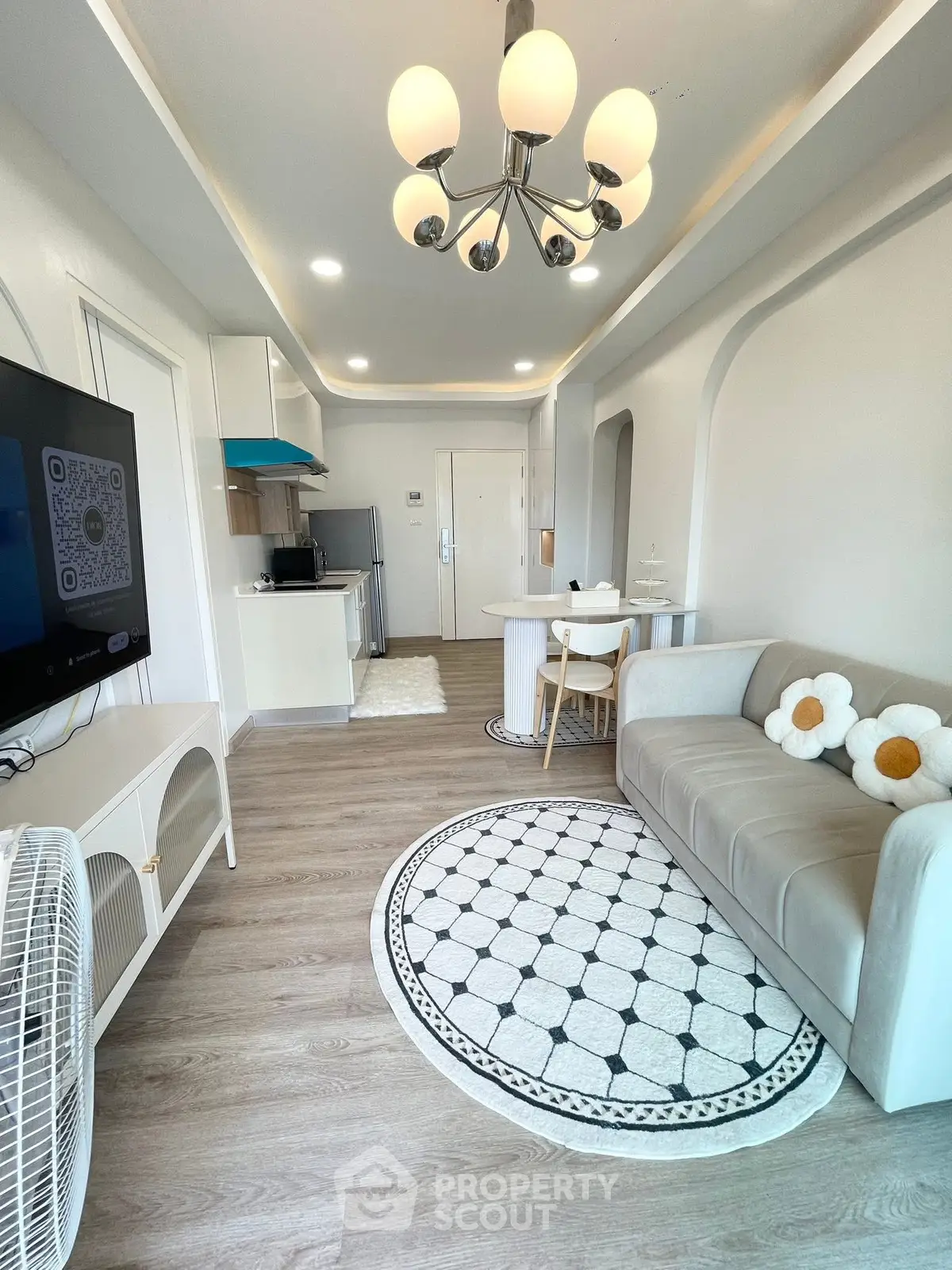 Modern living room with stylish decor and open kitchen layout