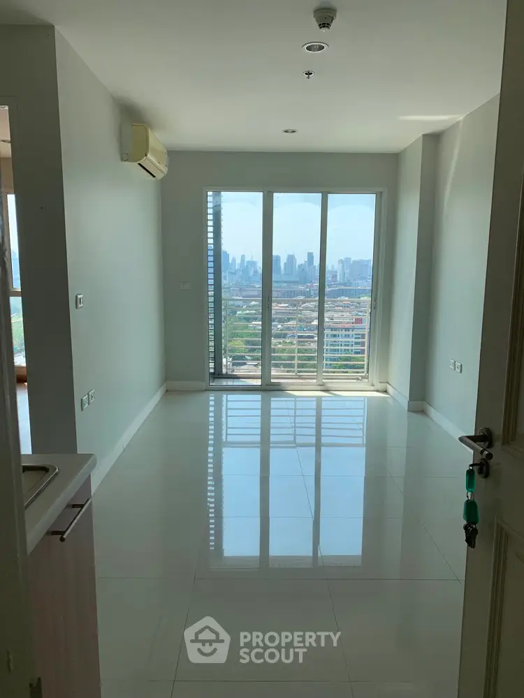 Bright empty room with city view and glossy tiled floor in modern apartment.