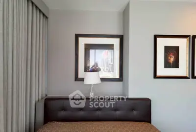 Modern bedroom with stylish decor and city view reflection in mirror