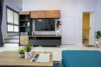 Modern living room with stylish TV unit and cozy decor