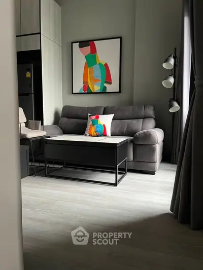Modern living room with stylish decor and comfortable seating in a contemporary apartment.