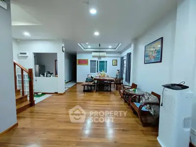 Spacious living room with wooden flooring and modern decor