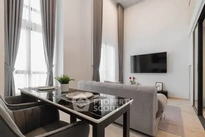 Modern living room with high ceilings, elegant curtains, and wall-mounted TV for luxurious comfort.