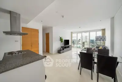 Modern open-plan living room with city view and sleek kitchen design