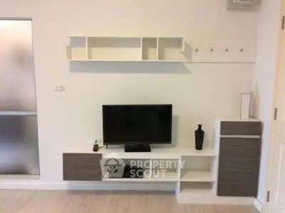 Modern living room with sleek TV unit and stylish shelving