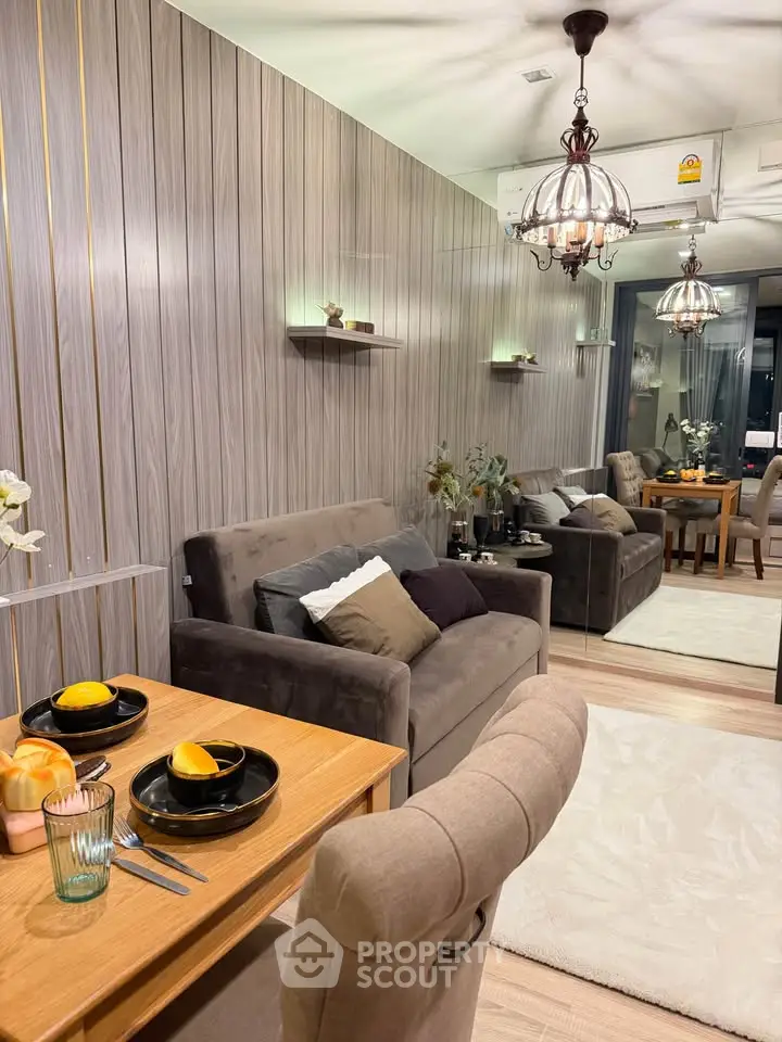 Stylish living room with elegant decor and cozy dining area in modern apartment.