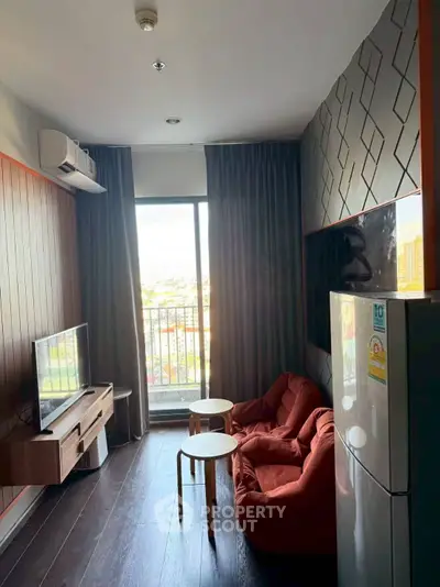 Modern living room with balcony view, stylish furniture, and sleek design