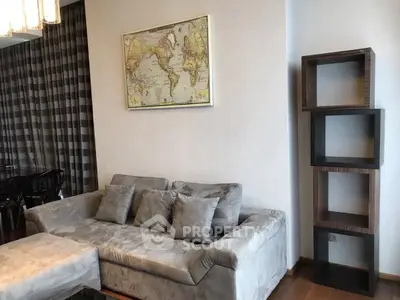 Stylish living room with plush sofa and modern decor in a contemporary apartment.
