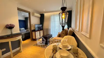 Charming living room with elegant decor and cozy dining area, perfect for modern living.