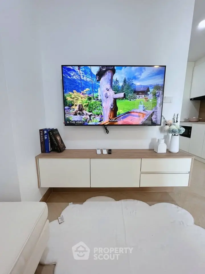 Modern living room with wall-mounted TV and stylish decor