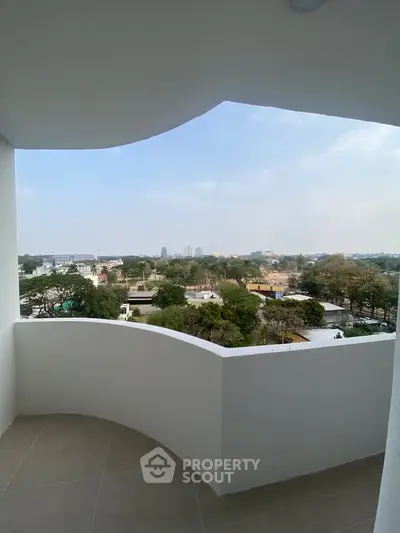 Stunning balcony view with expansive cityscape and lush greenery, perfect for relaxation and enjoying the outdoors.