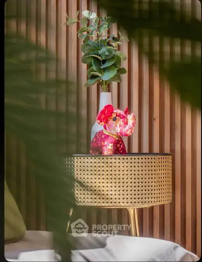 Stylish interior decor with a woven side table and vibrant elephant figurine, perfect for modern living spaces.