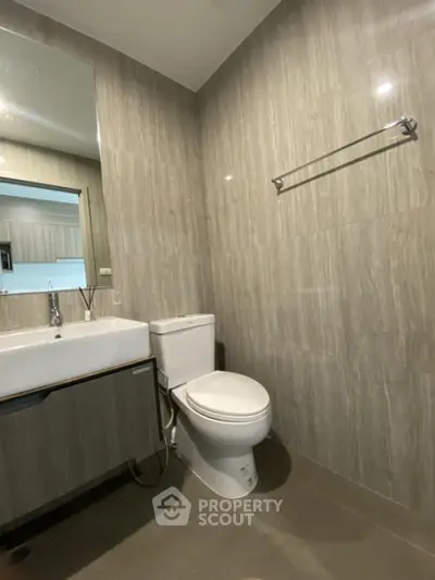 Modern bathroom with sleek fixtures and neutral tile design