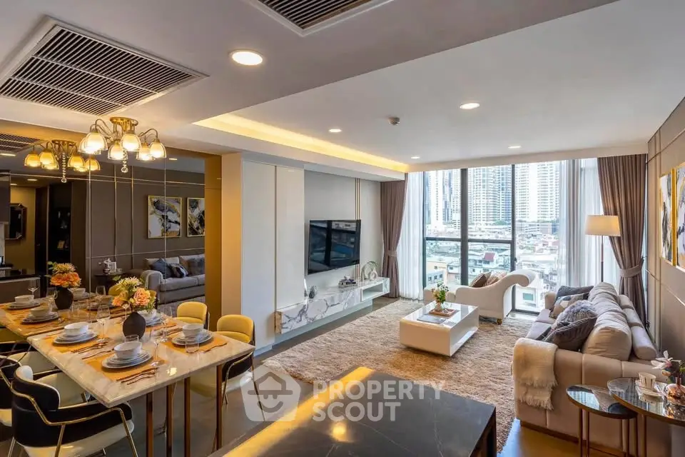 Luxurious open-plan living and dining area with city view, elegant decor, and modern furnishings.