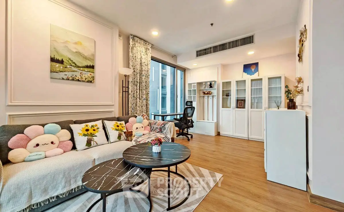 Charming living room with cozy decor and modern furniture, perfect for relaxation and entertaining.