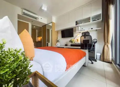 Modern bedroom with study area, featuring sleek furniture and vibrant decor.