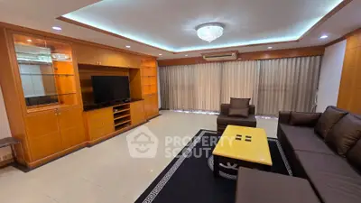 Spacious living room with elegant furniture and built-in entertainment center