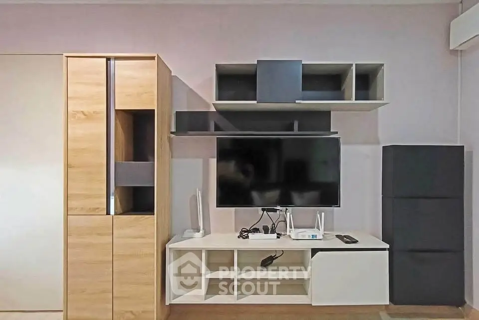 Modern living room with sleek TV unit and stylish shelving