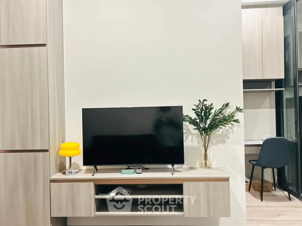 Modern living room with sleek TV setup and stylish decor