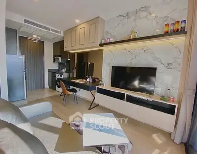 Modern living room with marble accent wall and sleek furniture