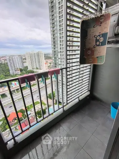 High-rise balcony with cityscape view, perfect for urban living enthusiasts.