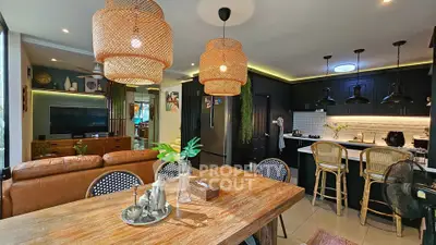 Chic open-plan living and dining area with modern kitchen and stylish decor