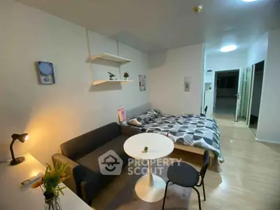 Modern studio apartment with cozy living area and stylish decor