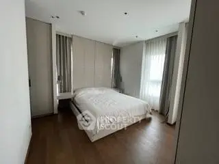 Spacious modern bedroom with elegant decor and natural light