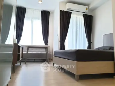 Modern bedroom with sleek furniture and natural light