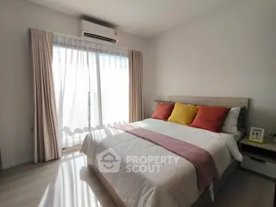 Cozy bedroom with natural light and modern decor