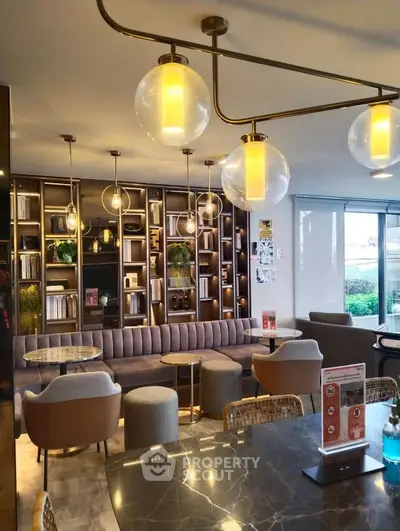 Luxurious modern living room with elegant lighting and stylish furniture, perfect for relaxation and entertainment.