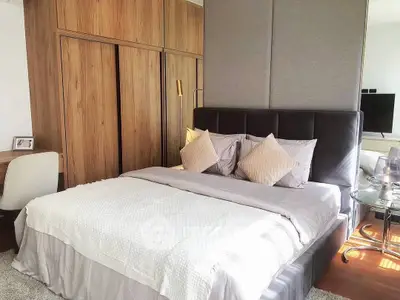 Luxurious bedroom with elegant decor and ample natural light