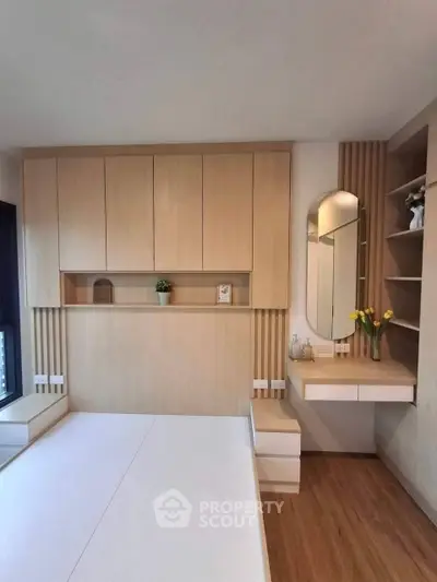 Modern bedroom with built-in storage and stylish vanity area