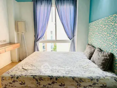 Bright bedroom with large window and stylish decor in modern apartment.