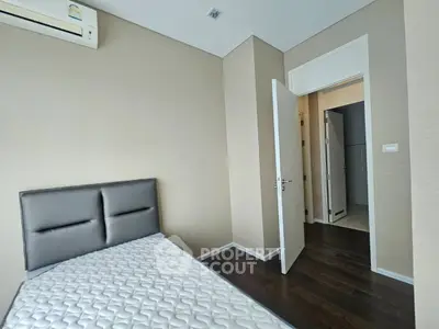 Modern bedroom with air conditioning and minimalist design in a contemporary apartment.