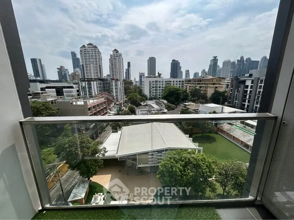 Stunning cityscape view from modern balcony overlooking urban skyline