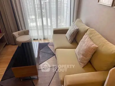 Stylish living room with modern sofa and elegant decor in a high-rise apartment.